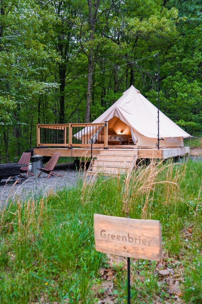 Glamping tent at a campsite marked "Greenbrier"